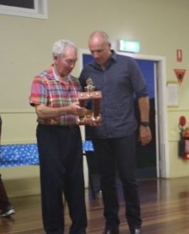Jack Leckie receives the Jim Adams Encouragement Perpetual Trophy from musical director Dave Thompson. 14 December 2016.