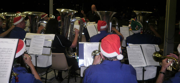 Ron Boaden is almost" kept in the dark" as he conducts CNL Brass