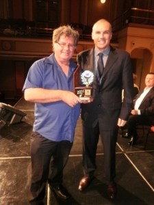 John Kellaway, Conductor of CNL Brass. accepts the 3rd place trophy for Division 1 of the Festival of the Bands from David Thompson, principal adjudicator.